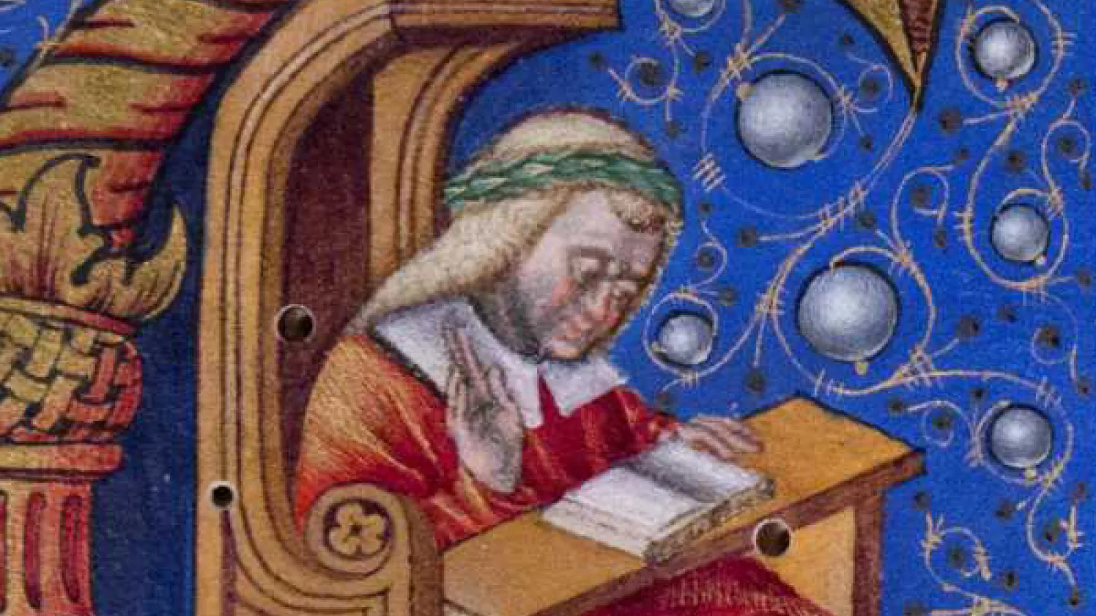 Decorated initial from a manuscript showing a man reading